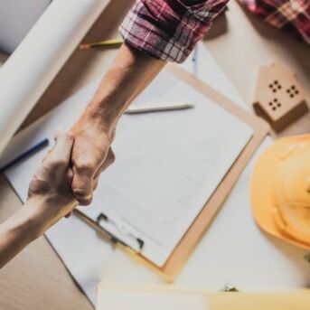 Client and contractor shaking hands following tender agreement / SMAS Worksafe